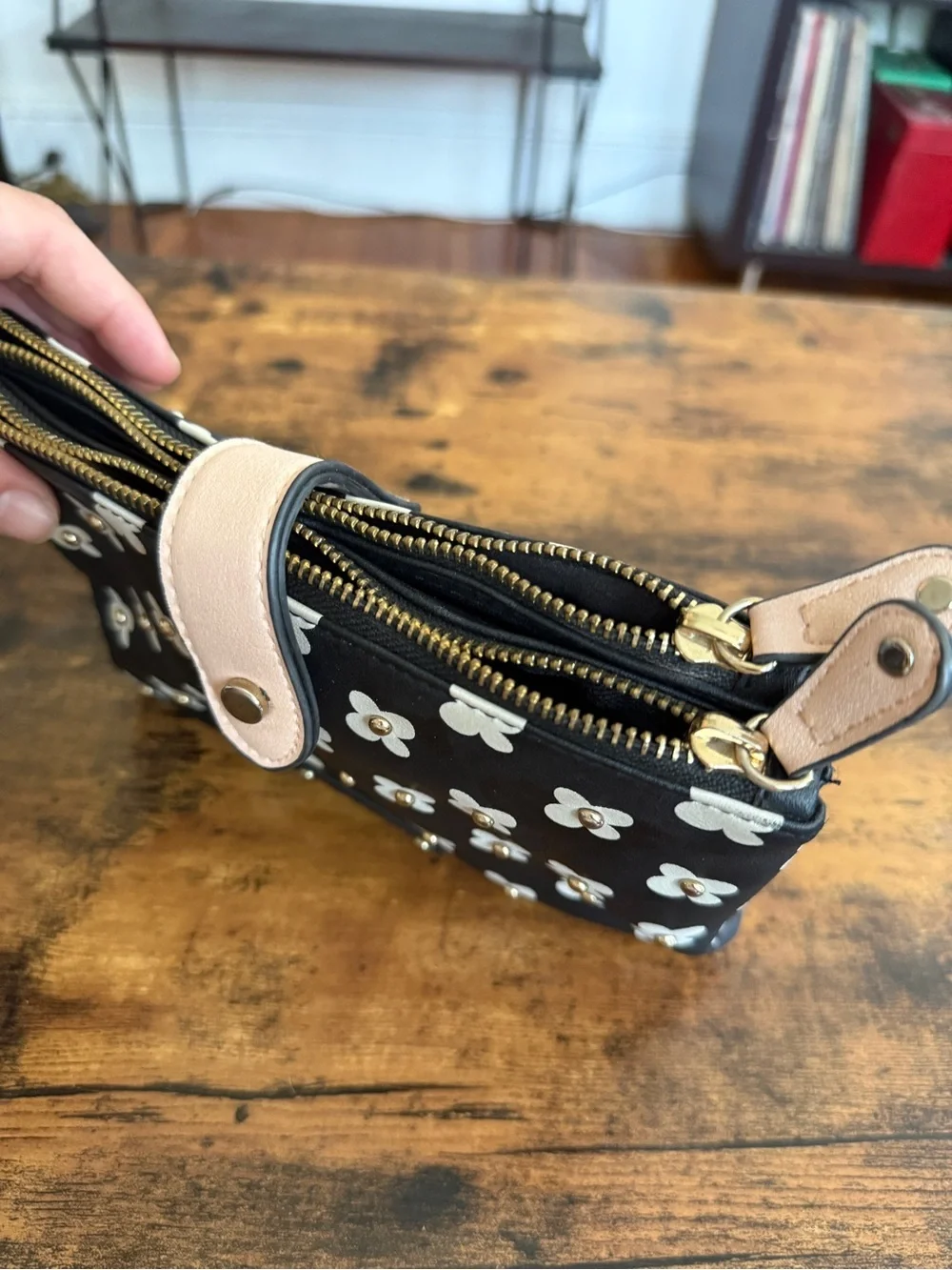 Kensie Black and Cream Floral Zip Wristlet with Tan Snap Strap
